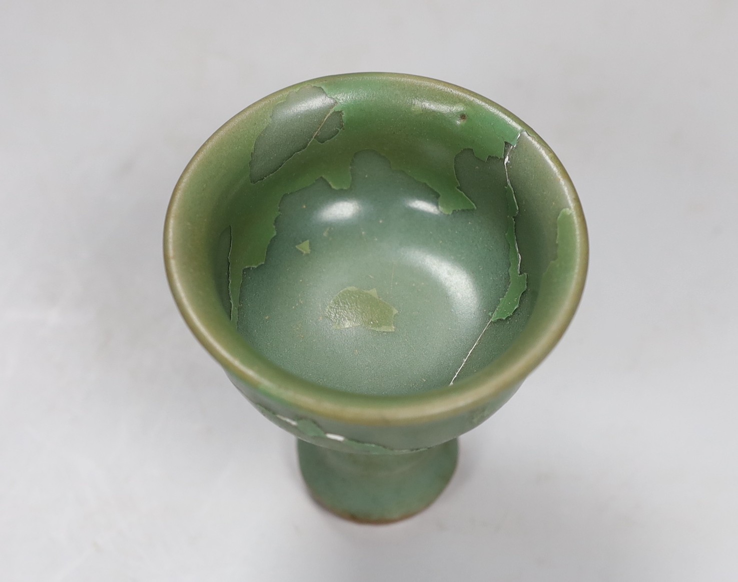 A Chinese Longquan celadon stem cup, Ming dynasty, 10cm, restored